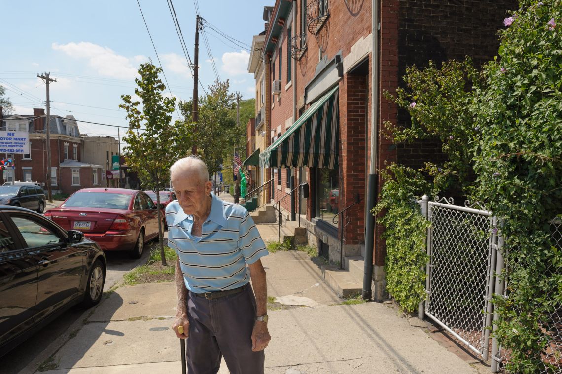 walking up the sidewalk