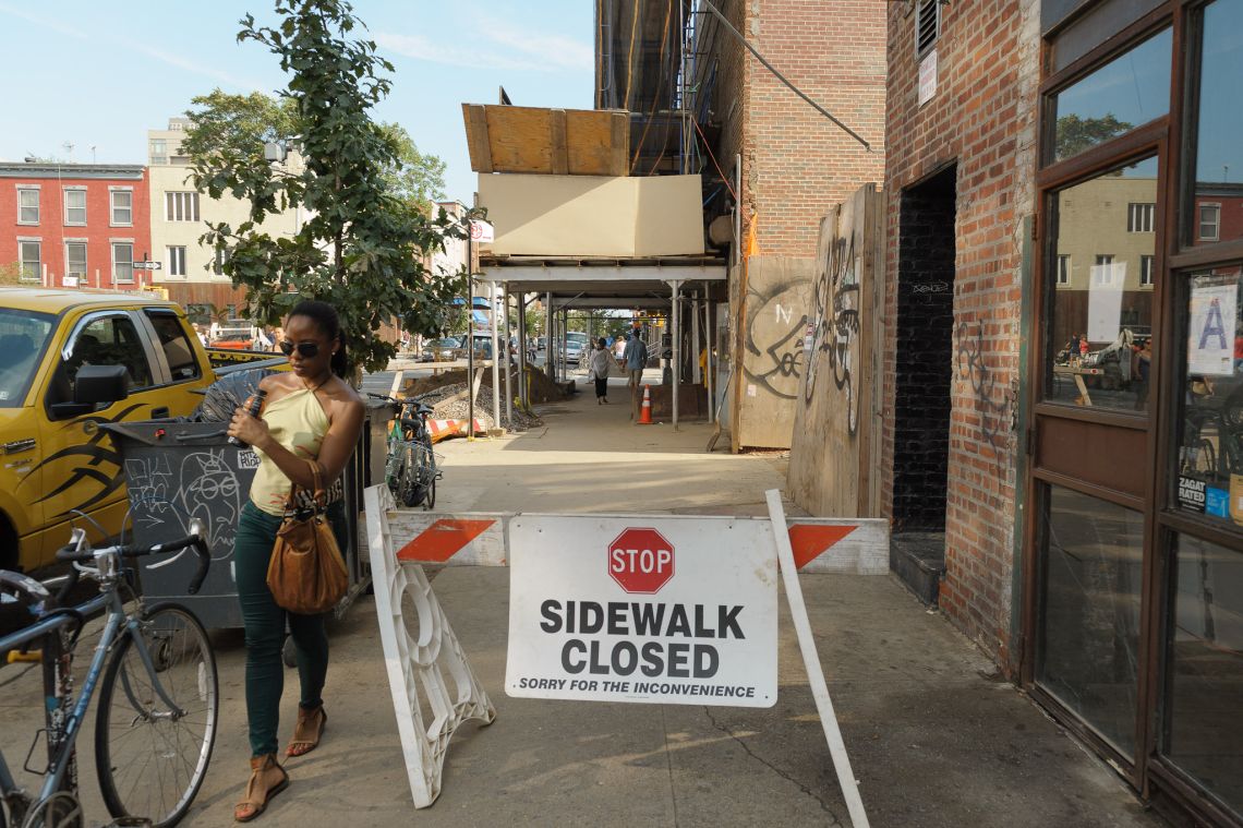 ignoring sign sidewalk closed brooklyn people