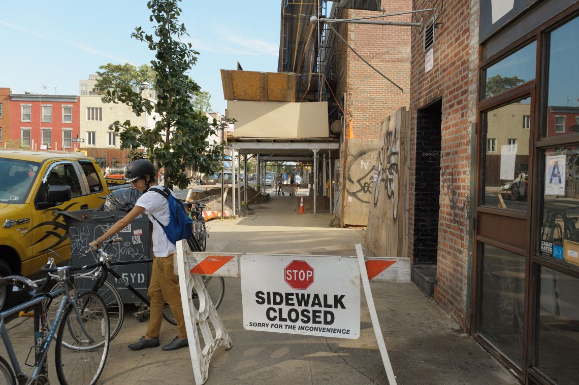 ignoring sign sidewalk closed brooklyn people