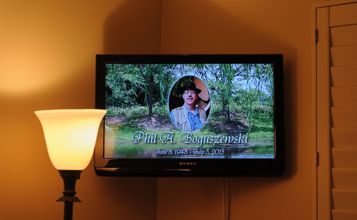 A LCD screen showed a scene of a forest, Uncle Phil's smiling face floating above it.