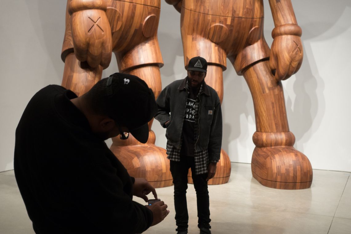 Posing in front of KAWS at Mary Boone