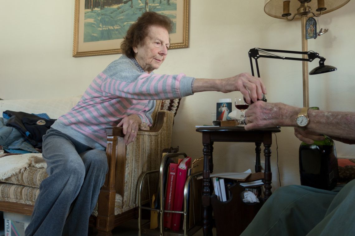 Grandma taking a glass
