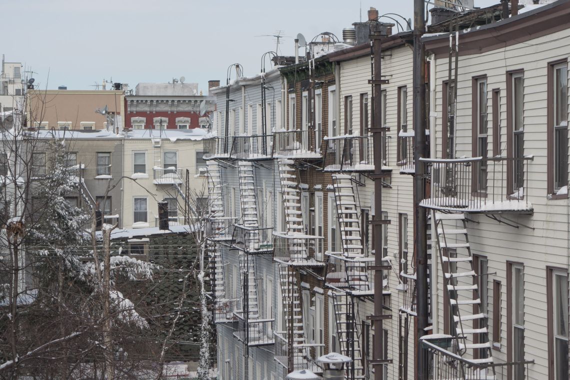 The homes and apartment buildings to the west