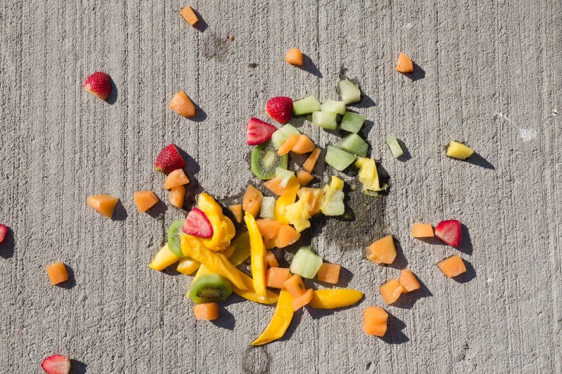Detail view of fruit salad on sidewalk