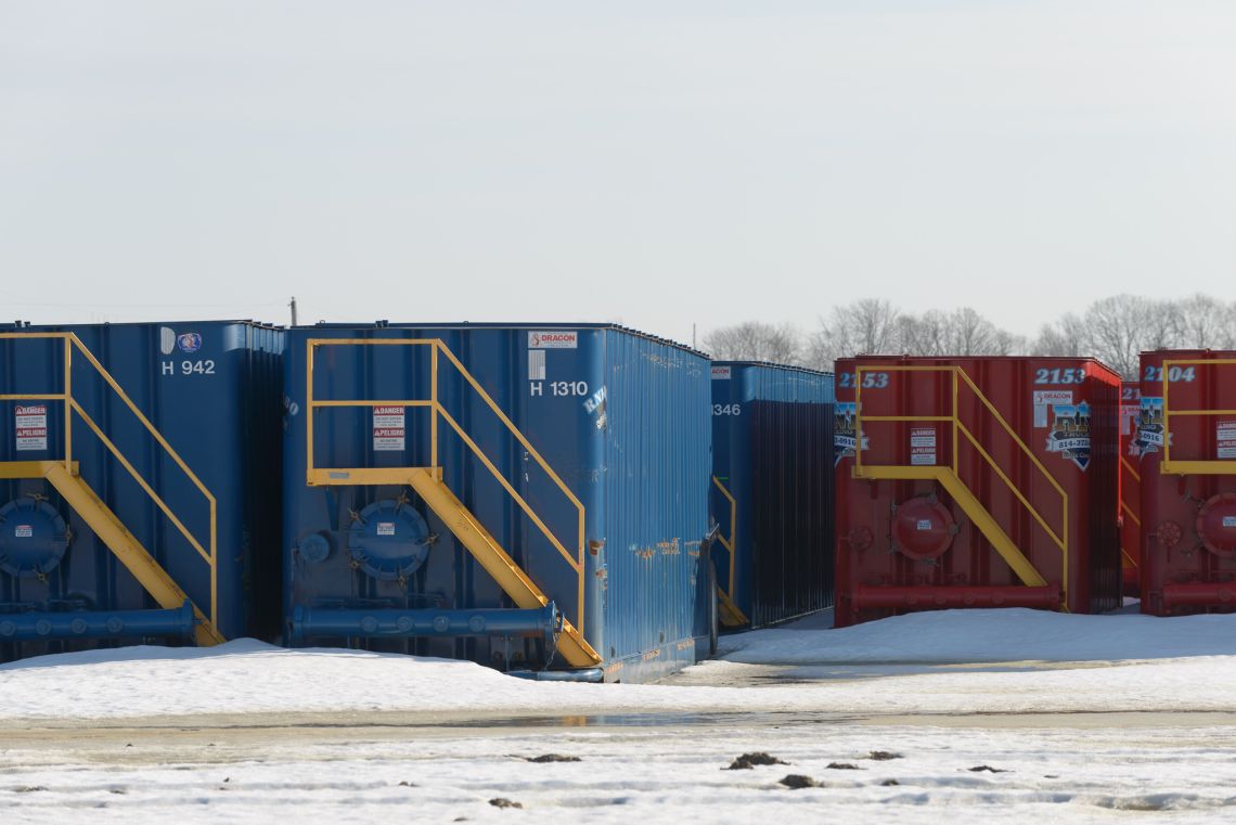 red and blue containers in the snow