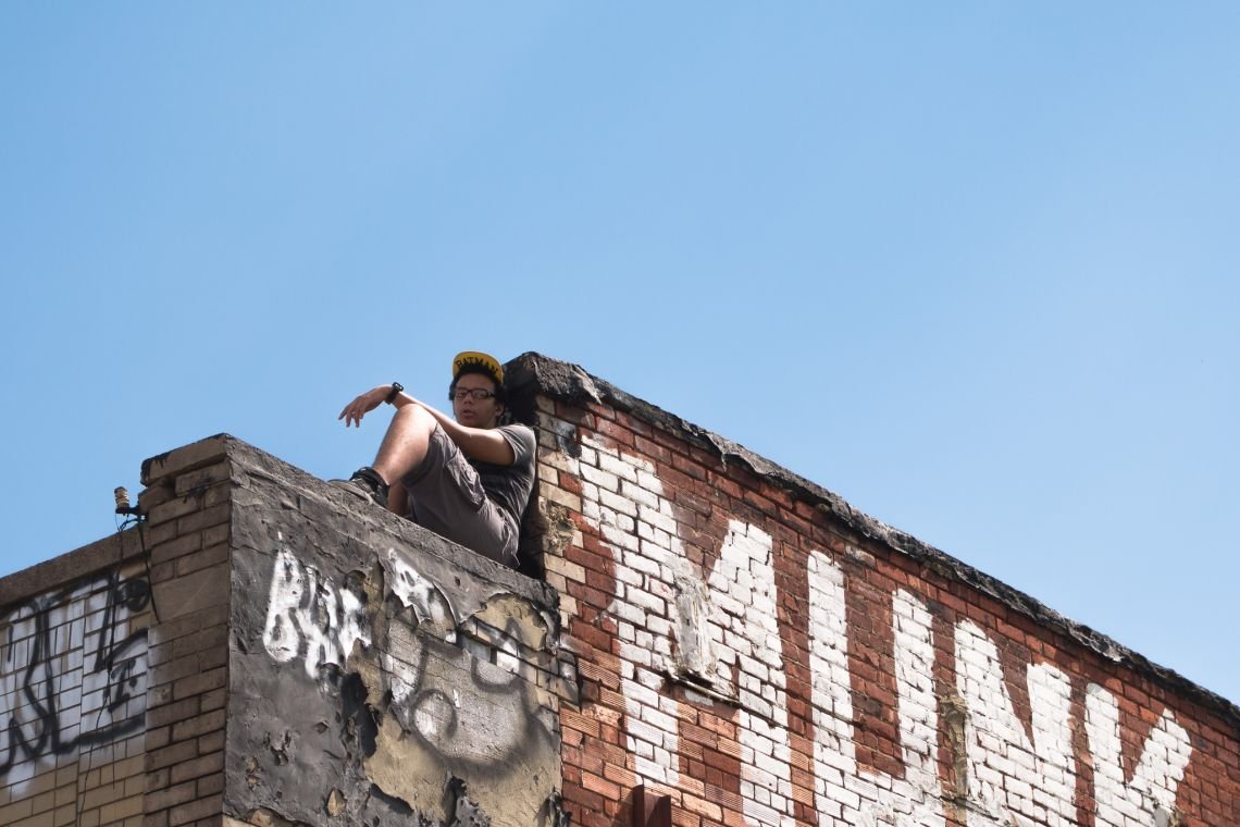 young man rooftop bed-stuy
