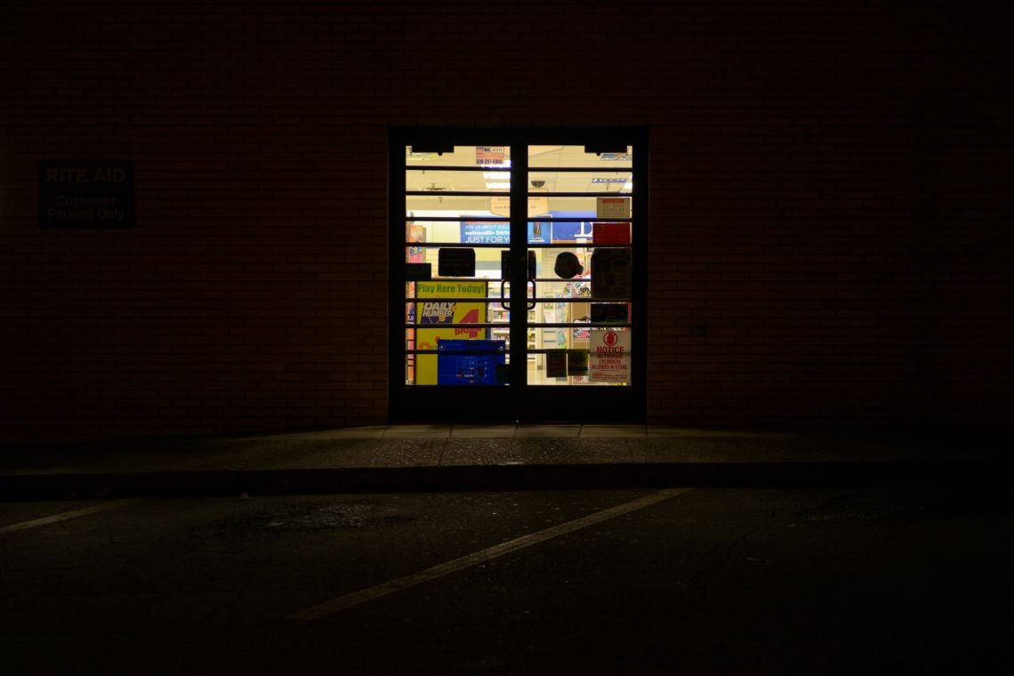 Entrance to drug store at night