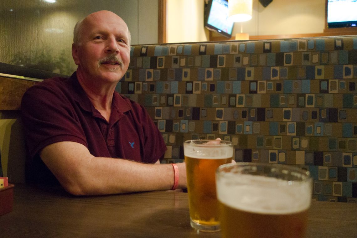 dad reflecting over a beer