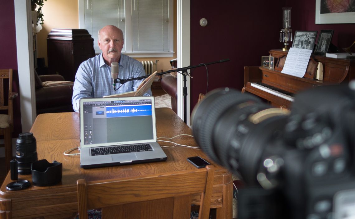 man prepares to make audio recording