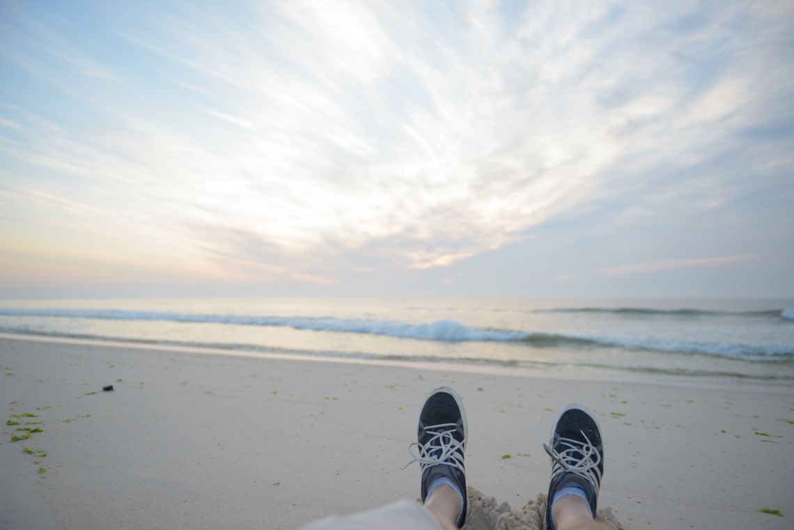 feet in sand sunrise