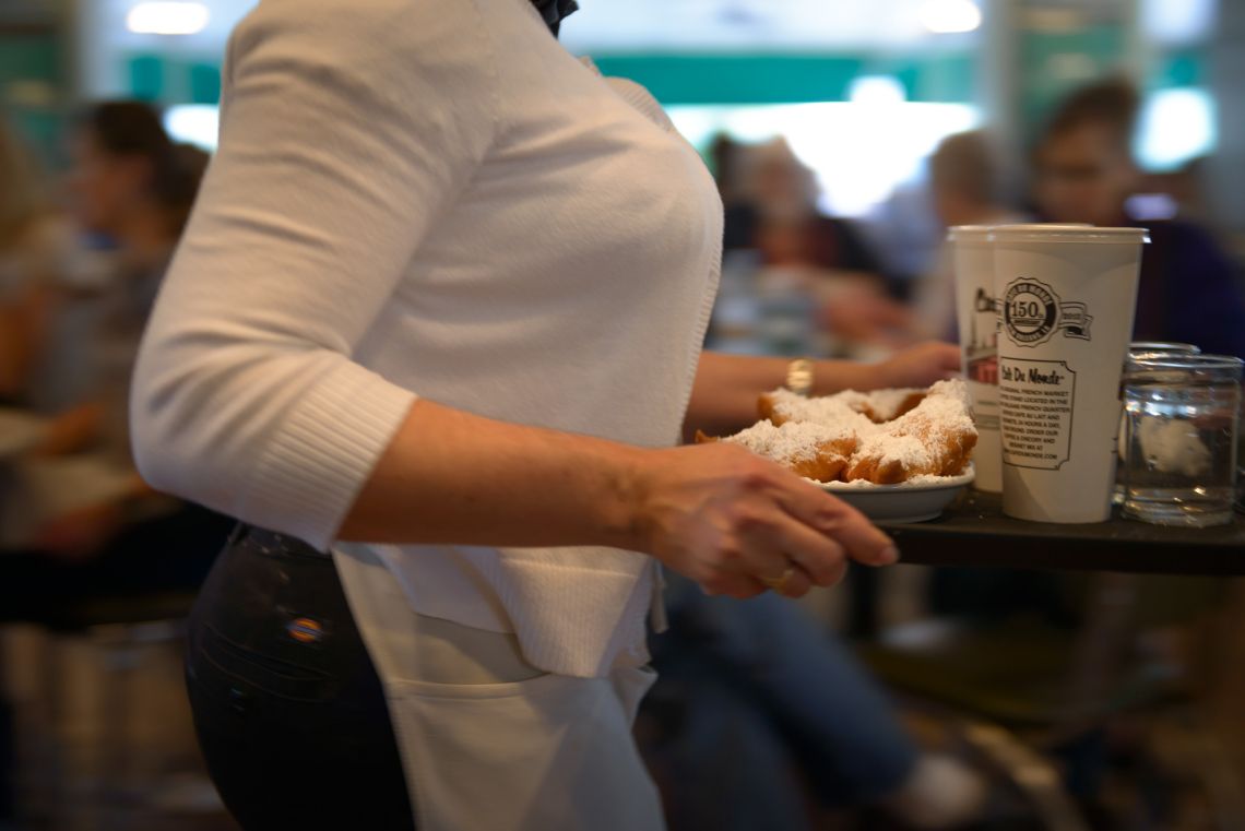waitress tray cafe du monde beignets coffee