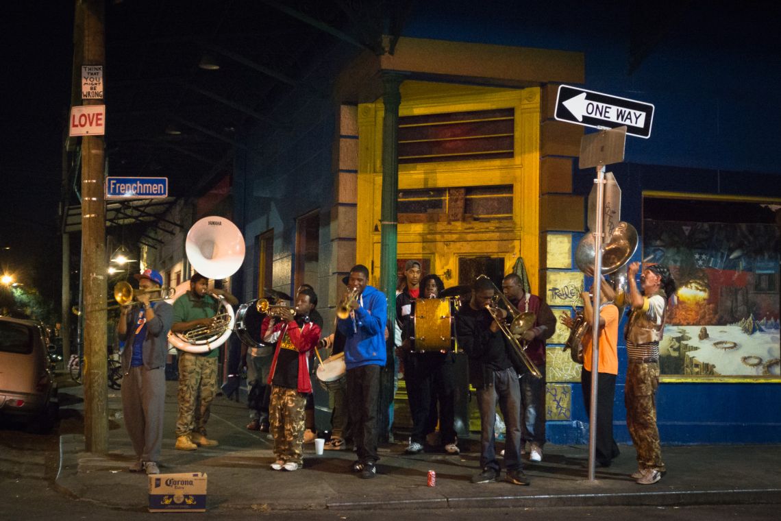 dirtbag drunk dude banging on stop sign with brass band