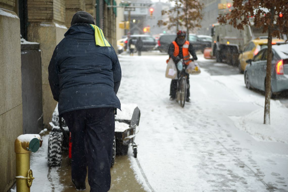 man snowblower in hudson square