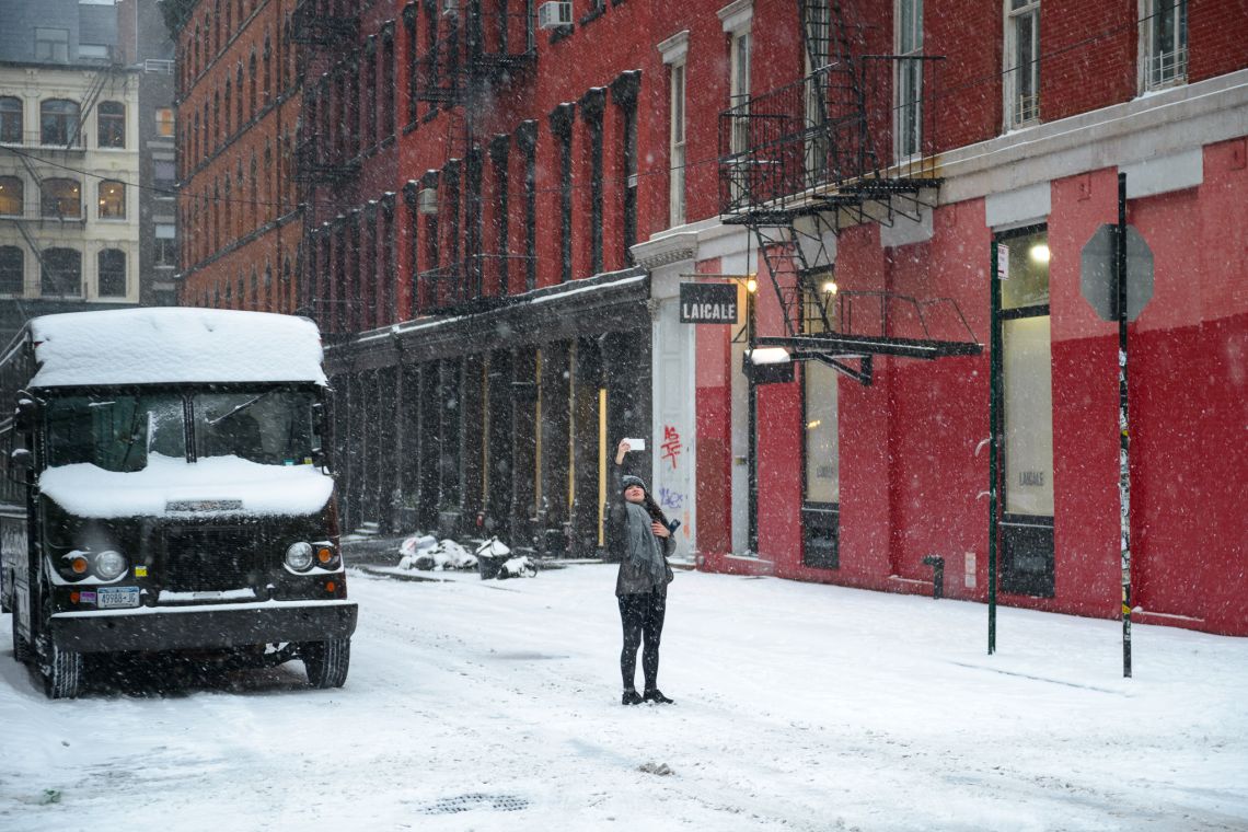 young woman snow selfie in soho nyc