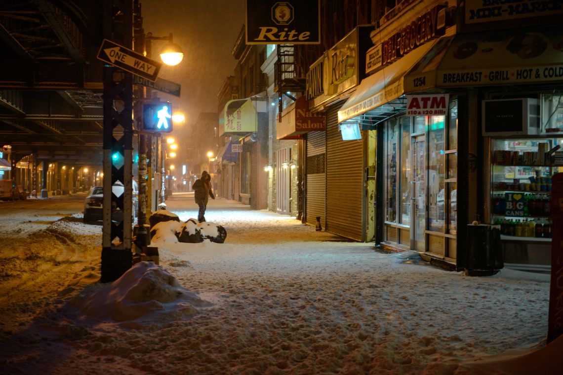 A woman stepping through the snow.