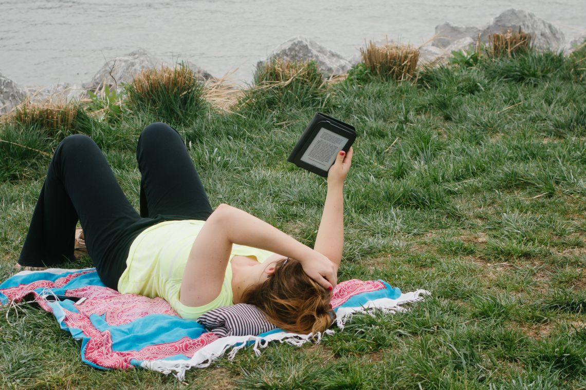 eReading in the grass at Transmitter Park
