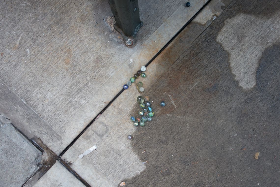 marbles scattered on nyc street