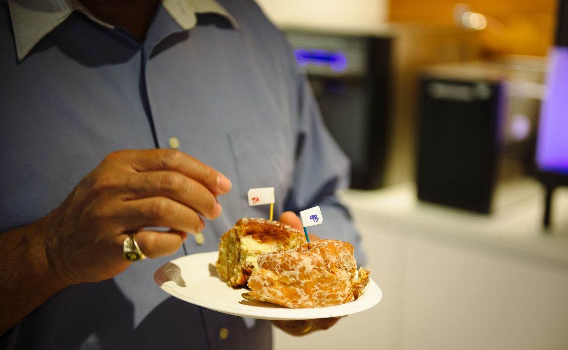 A coworker about to sample cinnamon rolls in the name of science