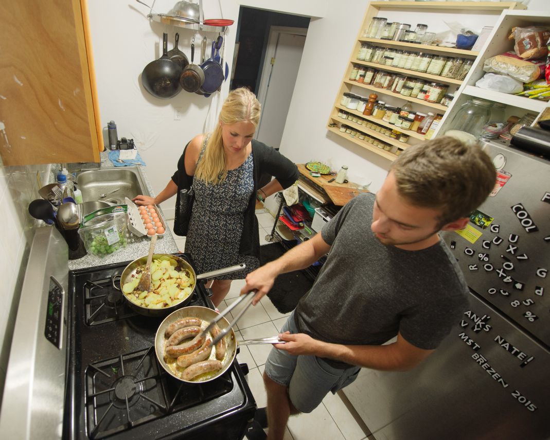 Surfers cooking a very German looking dinner