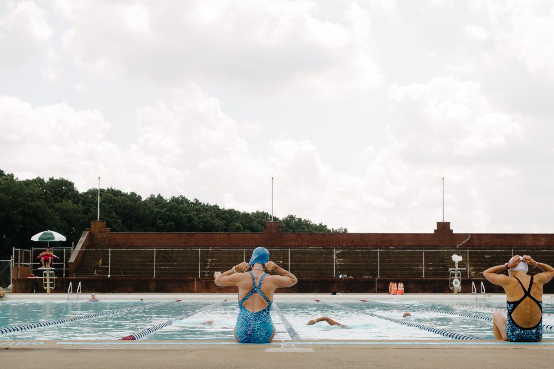 Ma puts on her swim cap.