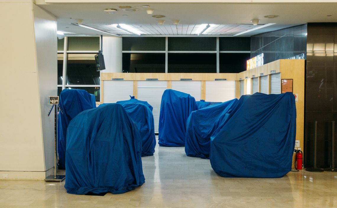 Tarps cover the vendor's wares.