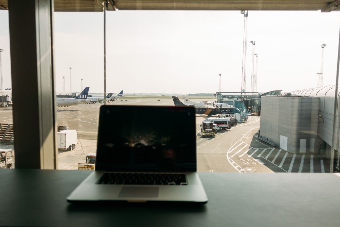 The landscape outside the terminal is flat, obscured by haze.