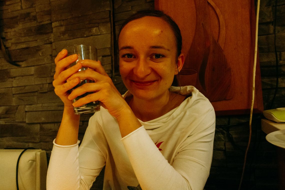Teresa at a table of thali