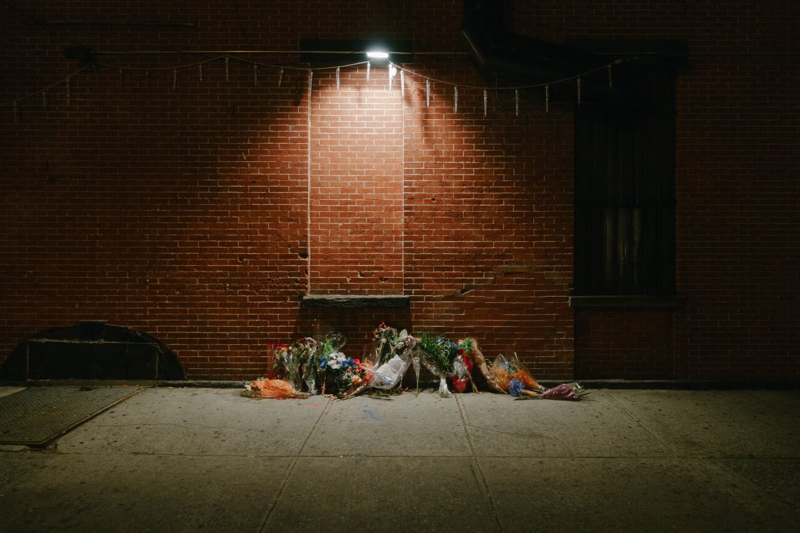 Floral memorial on the sidewalk on Thompkins at Myrtle