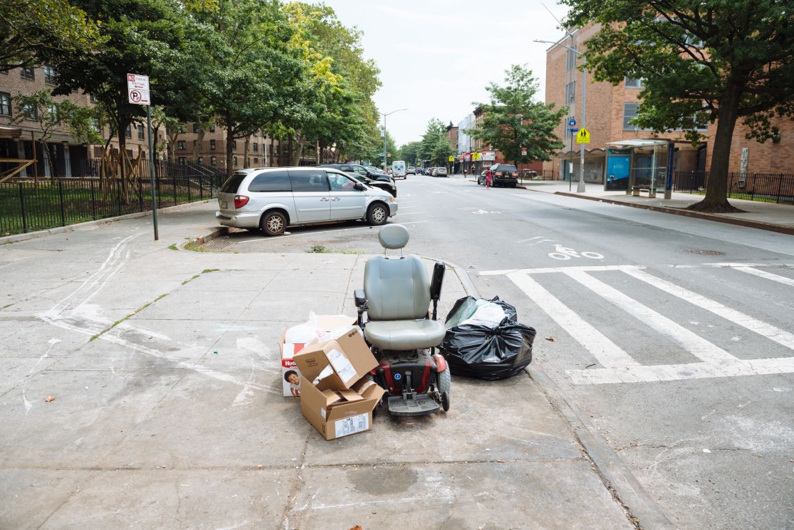 An electric scooter among other garbage