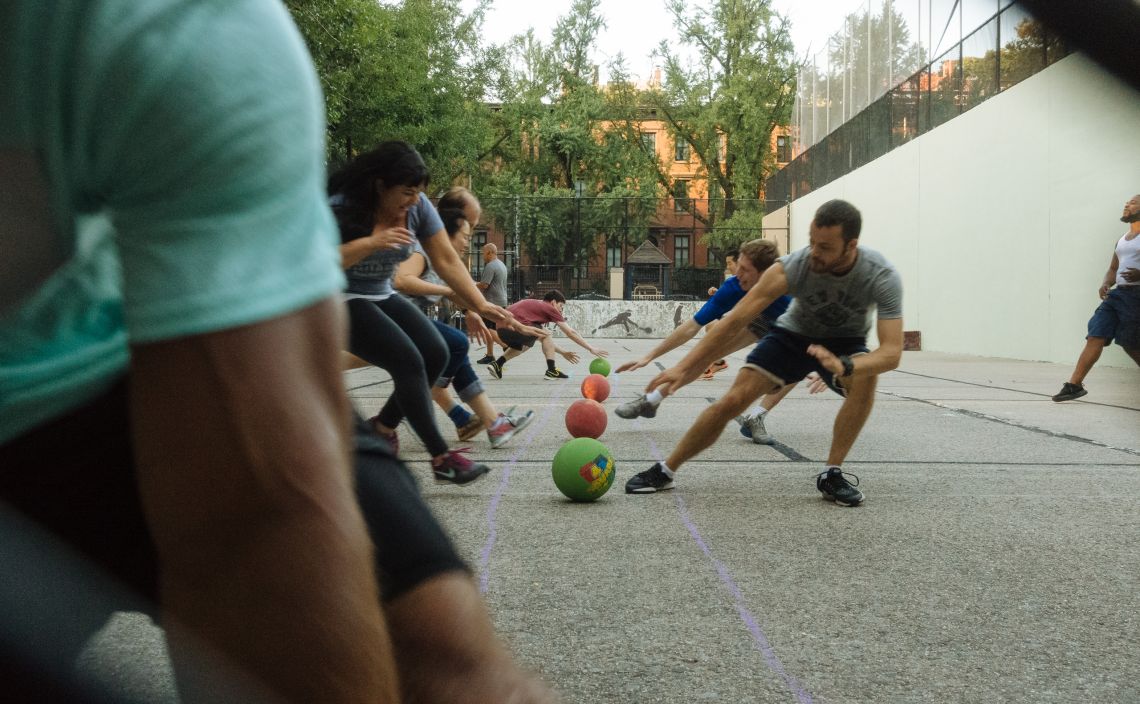 Dodgeball players grabbing balls