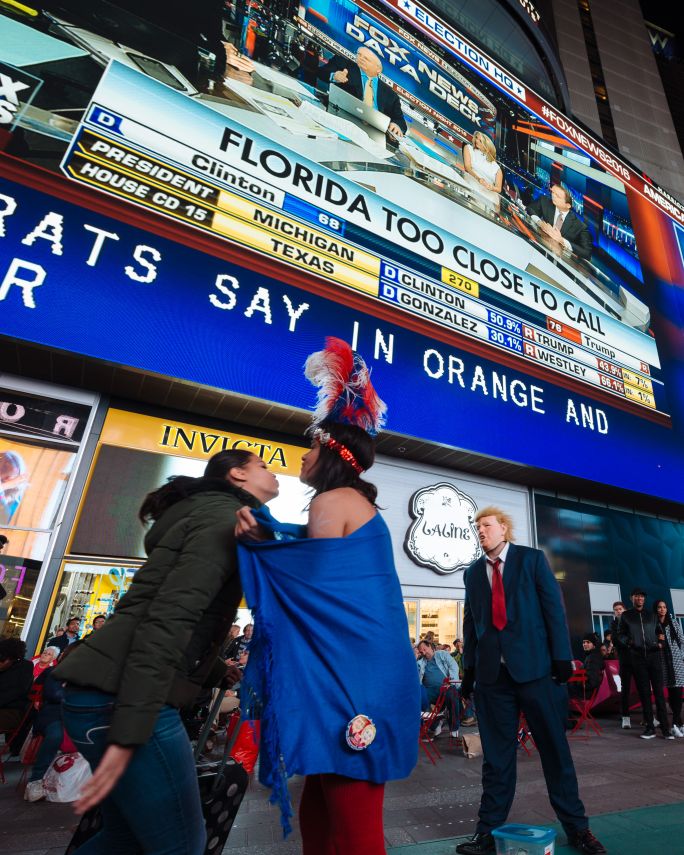 Trump performer leering at desnudas in Times Square
