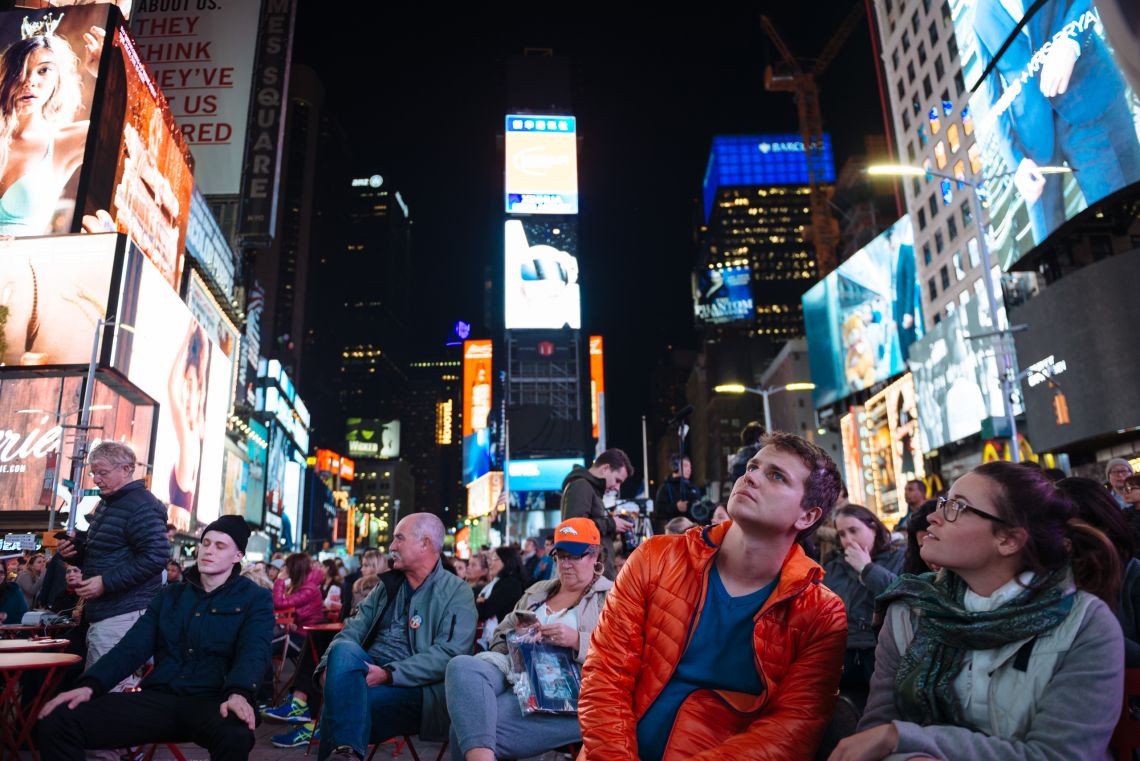 Watching the results trickle in at Times Square