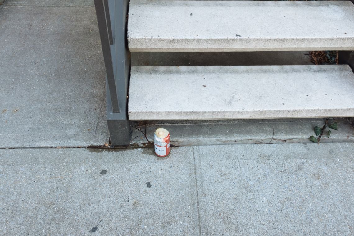 Frozen-over can of Budweiser at base of Berry St. stoop