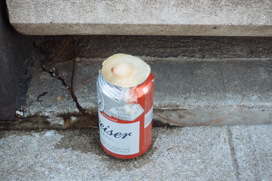 Frozen-over can of Budweiser at base of Berry St. stoop (detail)