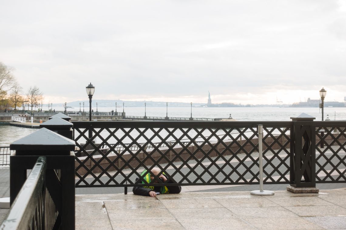 Security guard on a call in the Battery Park Esplenade