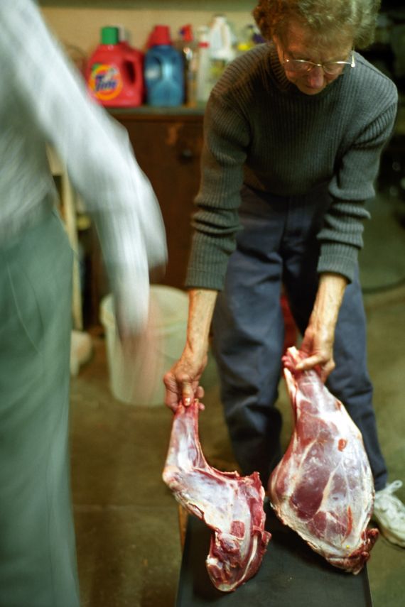 elderly couple carving deer in basement of wexford pittsburgh pennsylvania