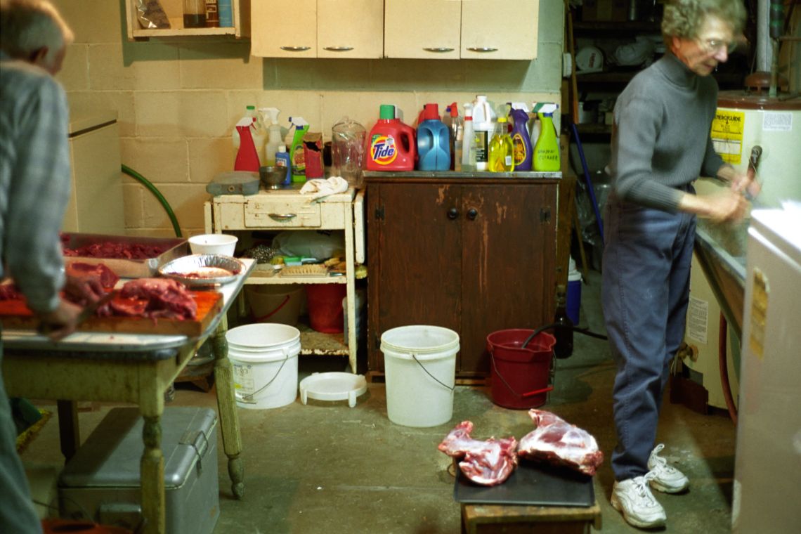 elderly couple carving deer in basement of wexford pittsburgh pennsylvania