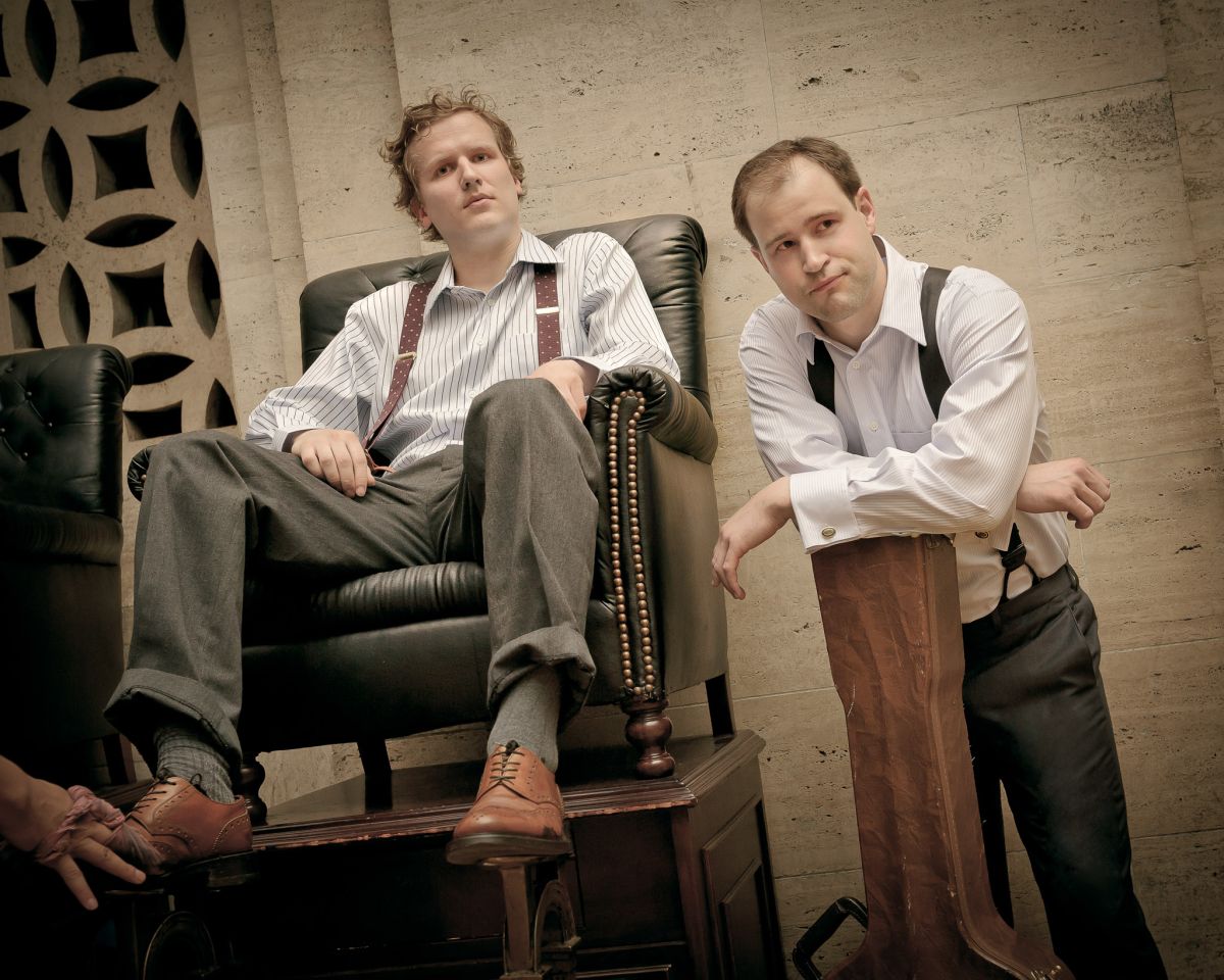 cash fur gold musicians posing at shoe shine stand in grand central station