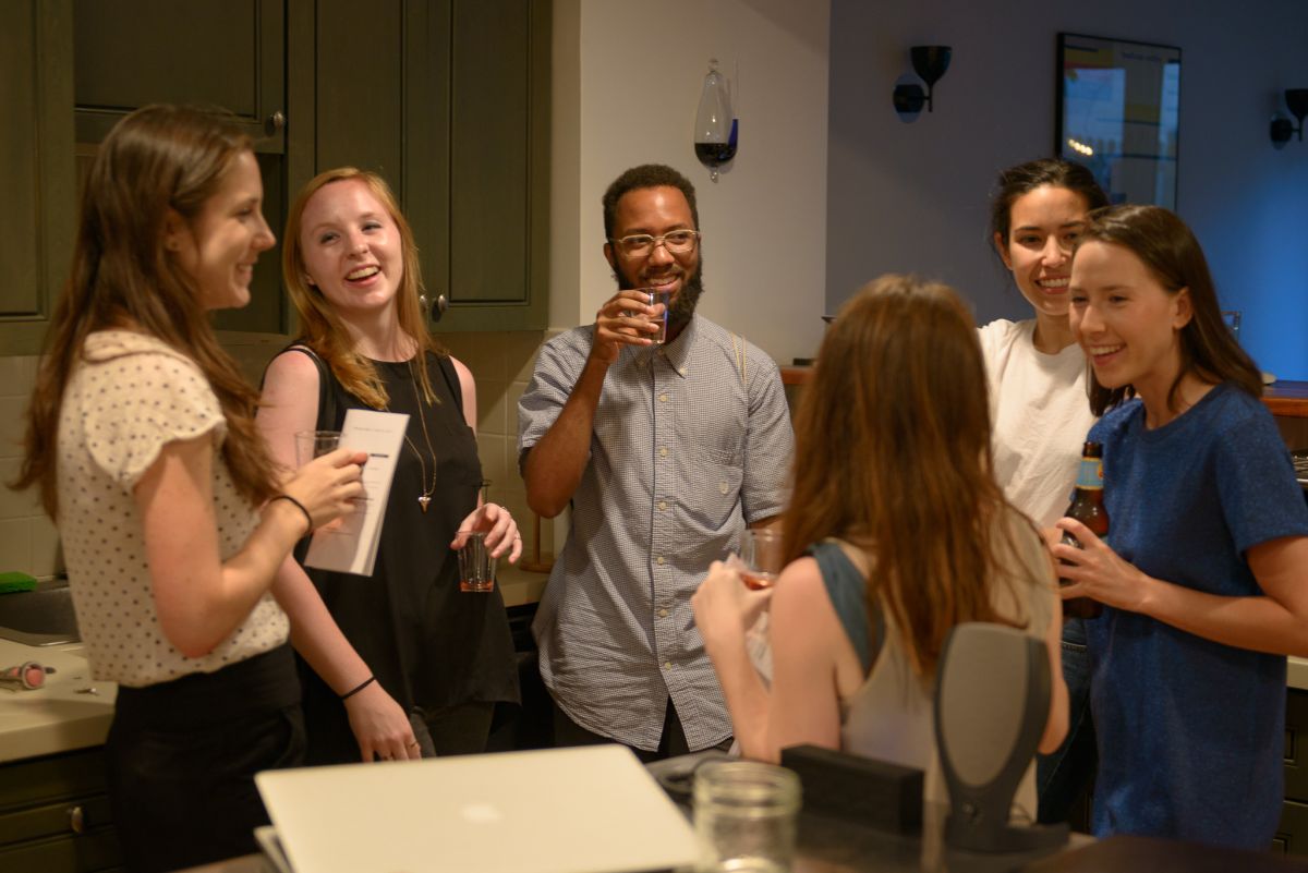 Guests gather in the kitchen.
