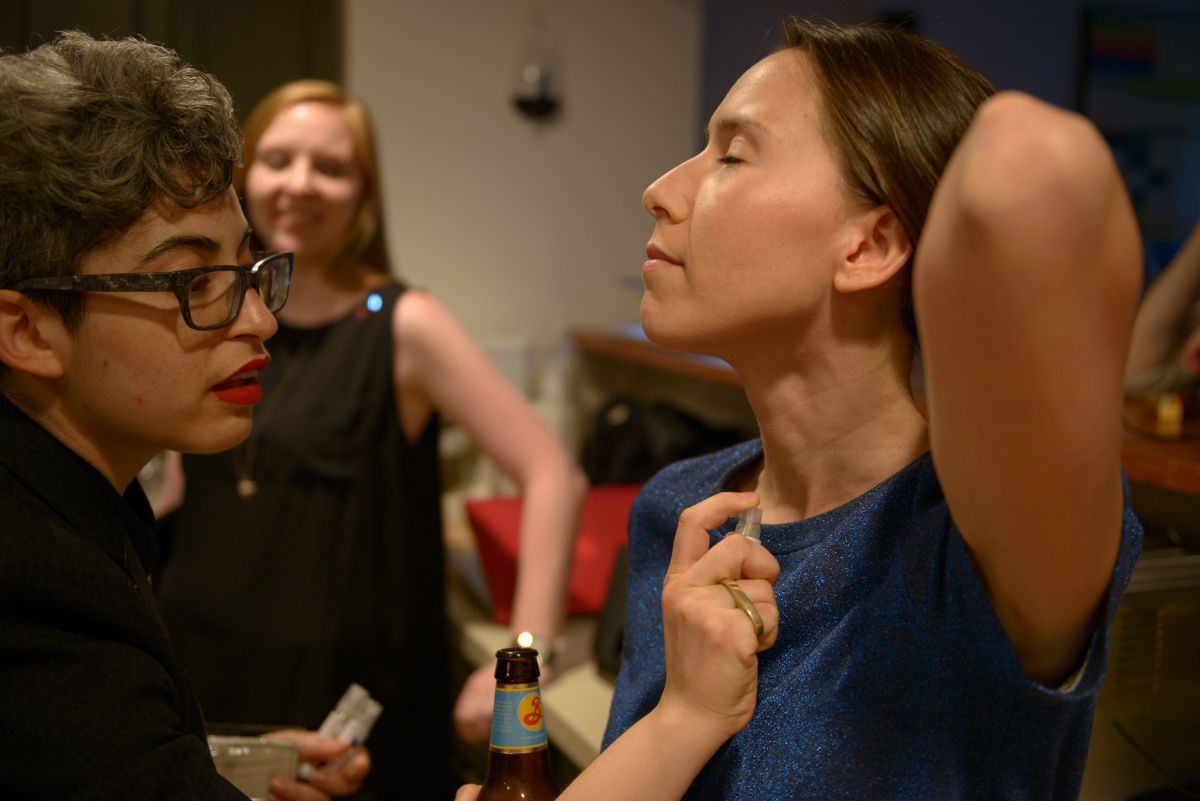 A guest is spritzed with pheromone for women