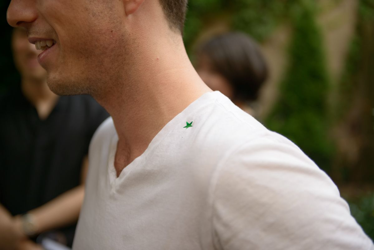 The guest tagged with a green star, signifying pheromone he was sprayed with.