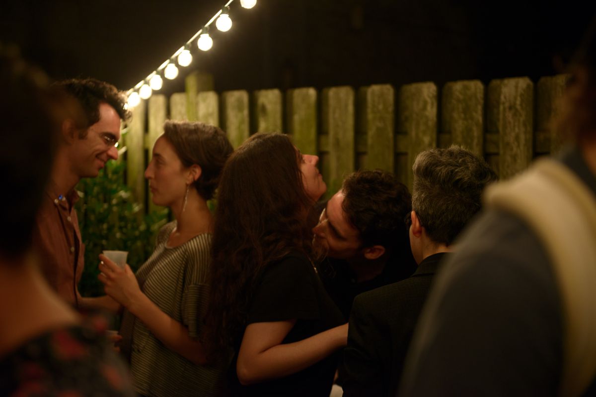 A guest evaluates the pheromone another guest was spritzed with.