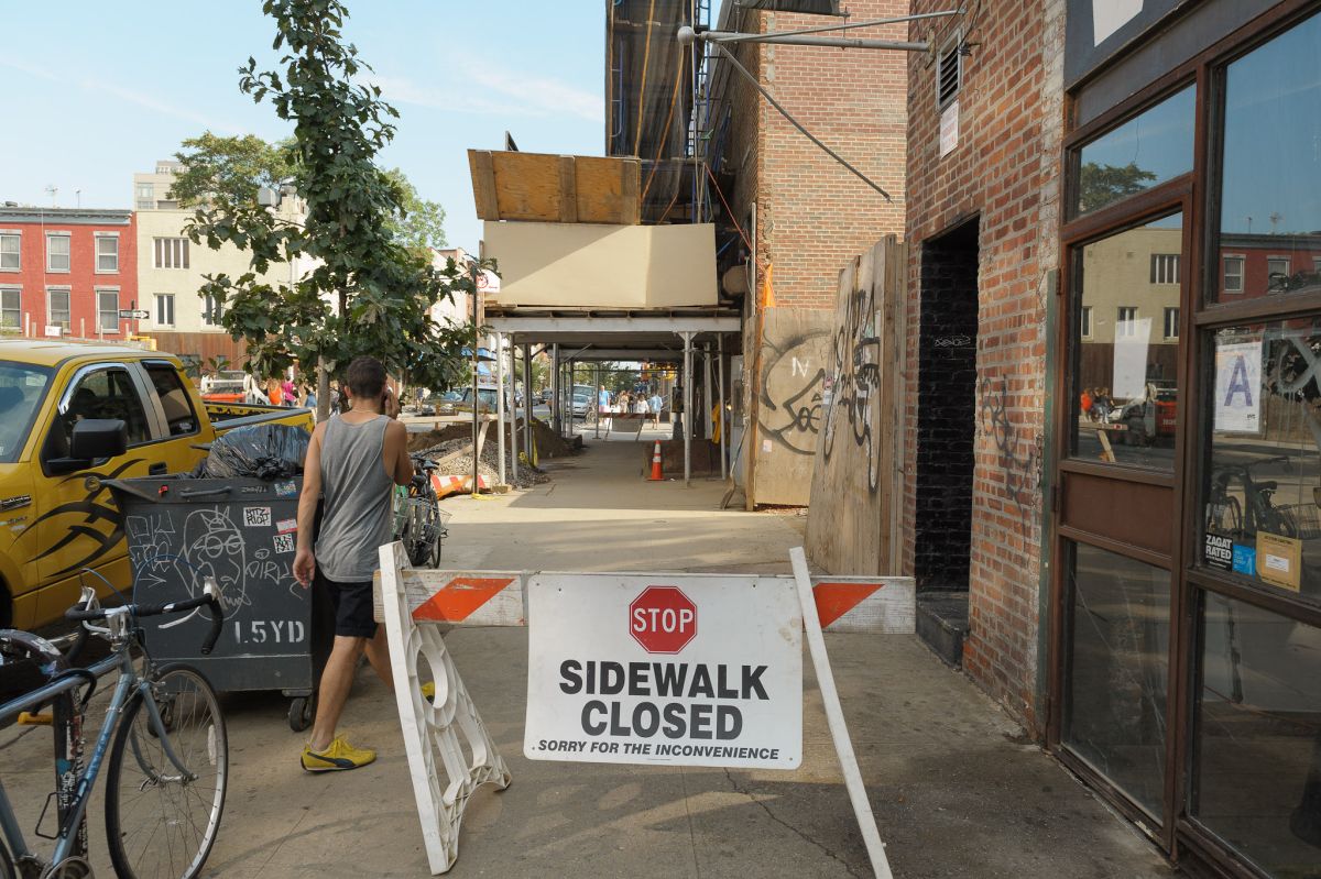 ignoring sign sidewalk closed brooklyn people