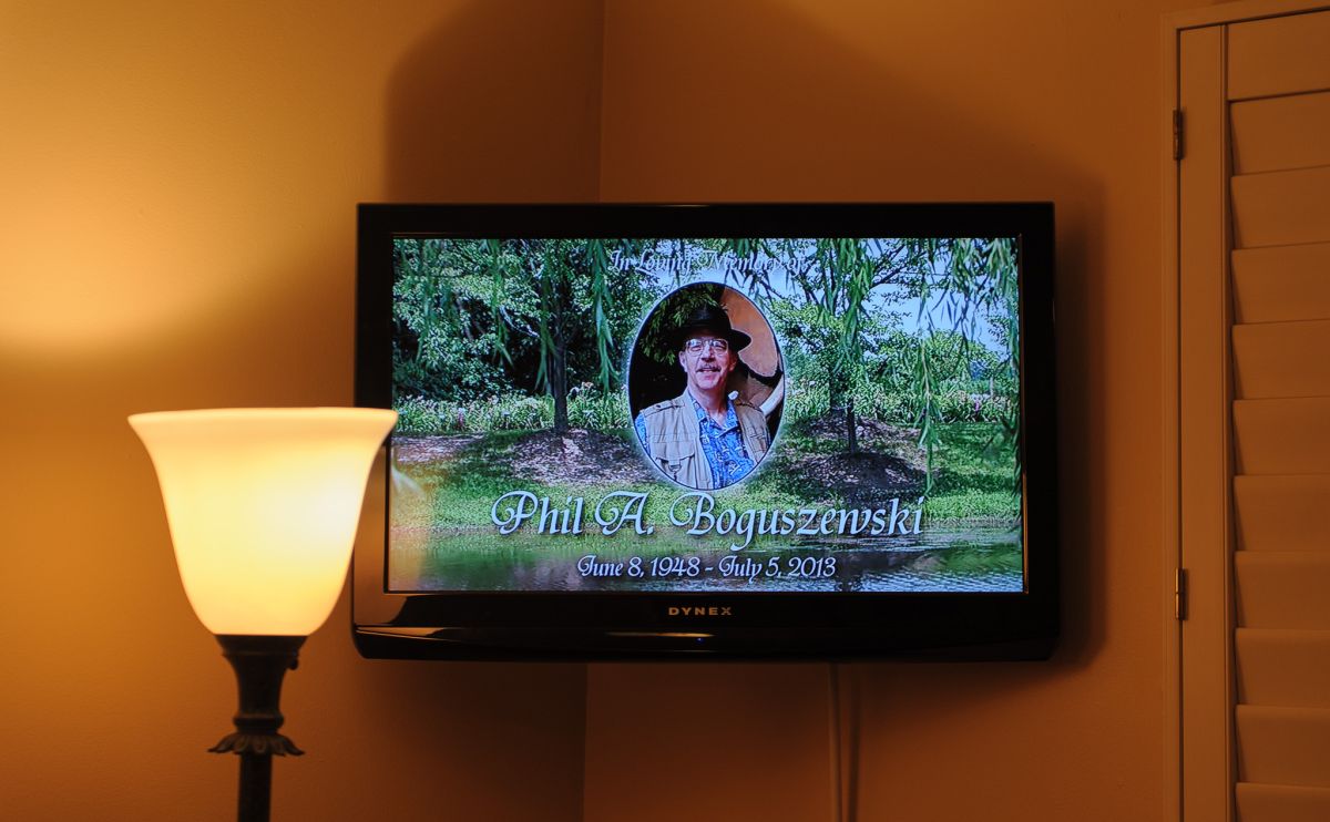 A LCD screen showed a scene of a forest, Uncle Phil's smiling face floating above it. 