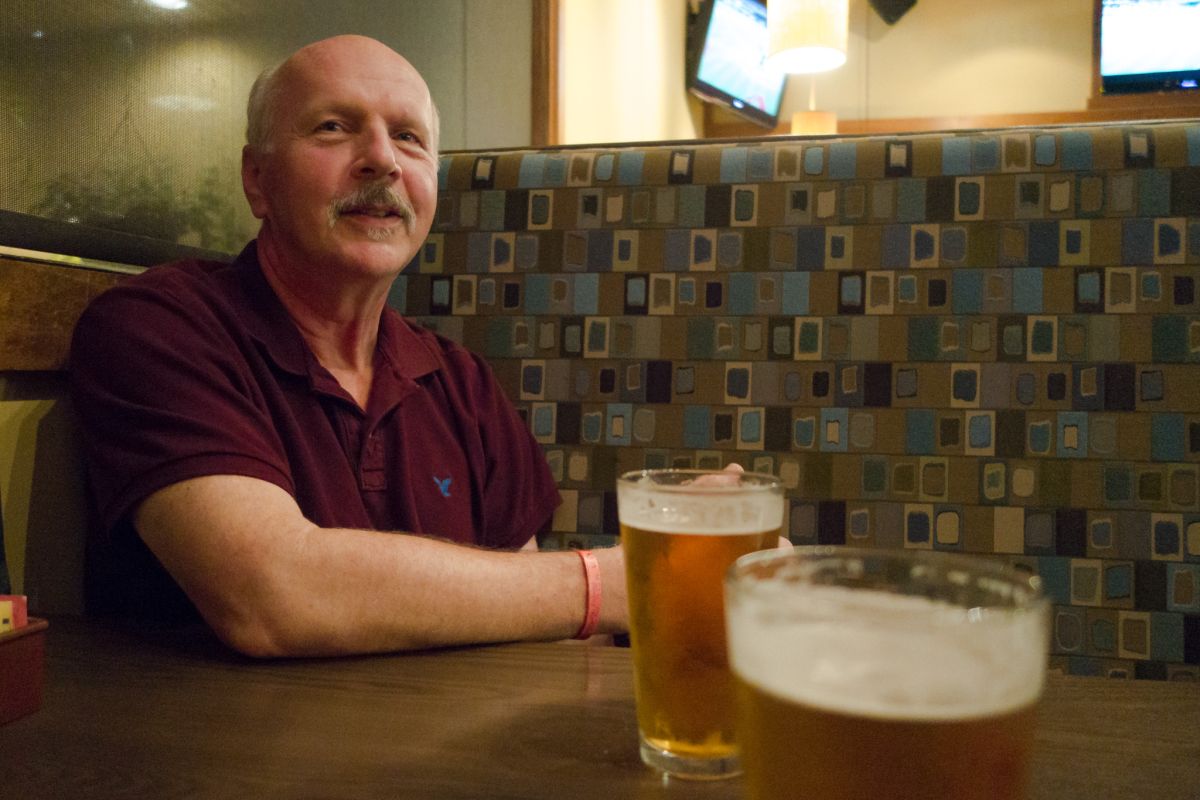 dad reflecting over a beer