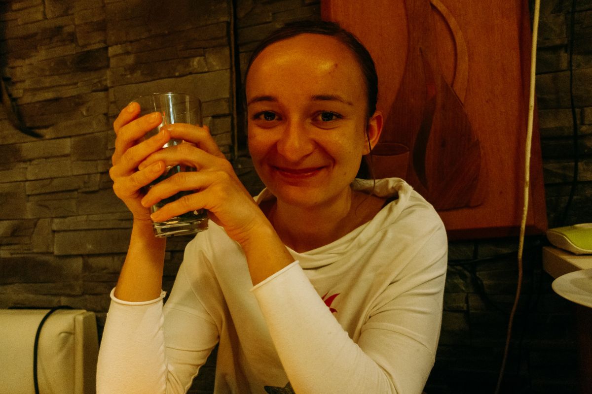 Teresa at a table of thali