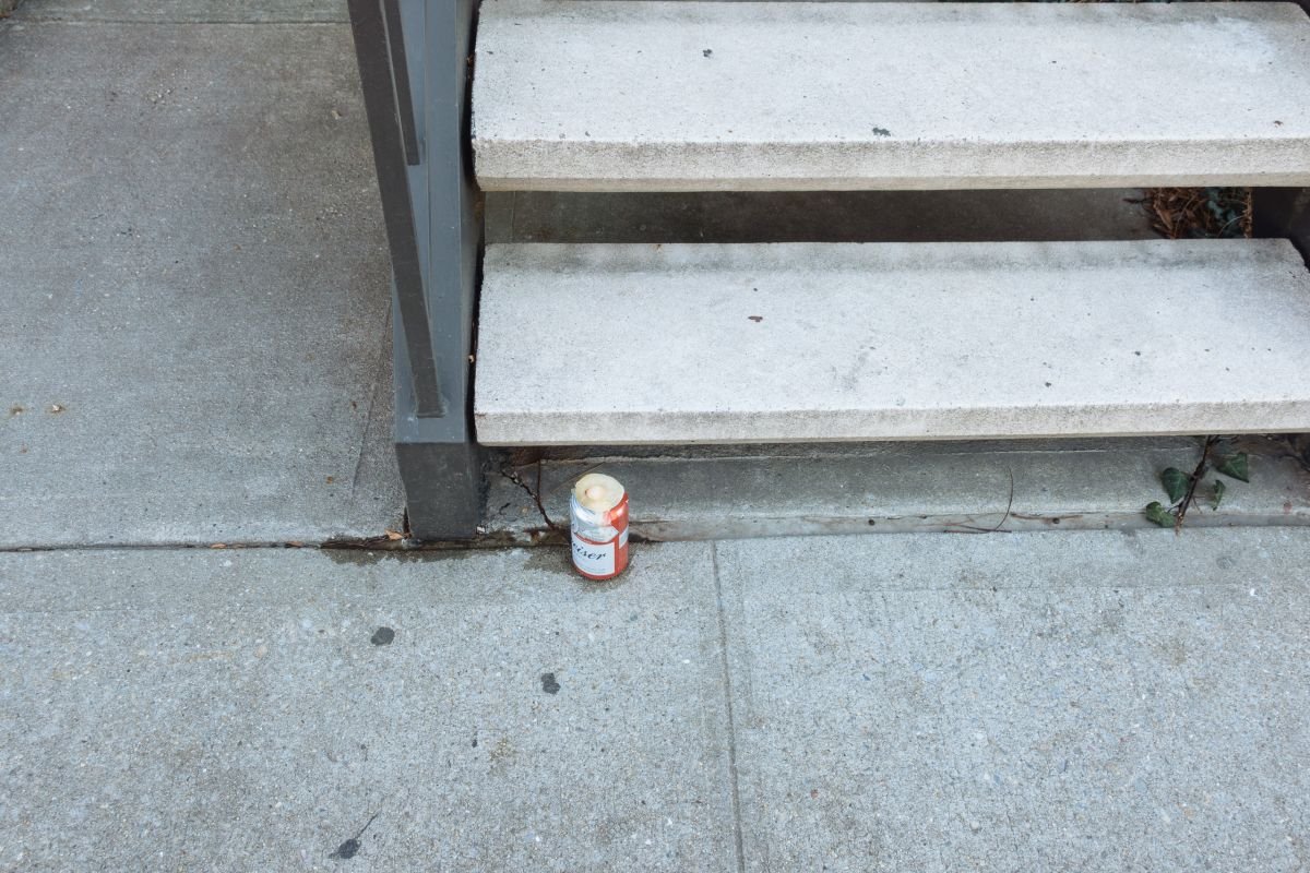 Frozen-over can of Budweiser at base of Berry St. stoop