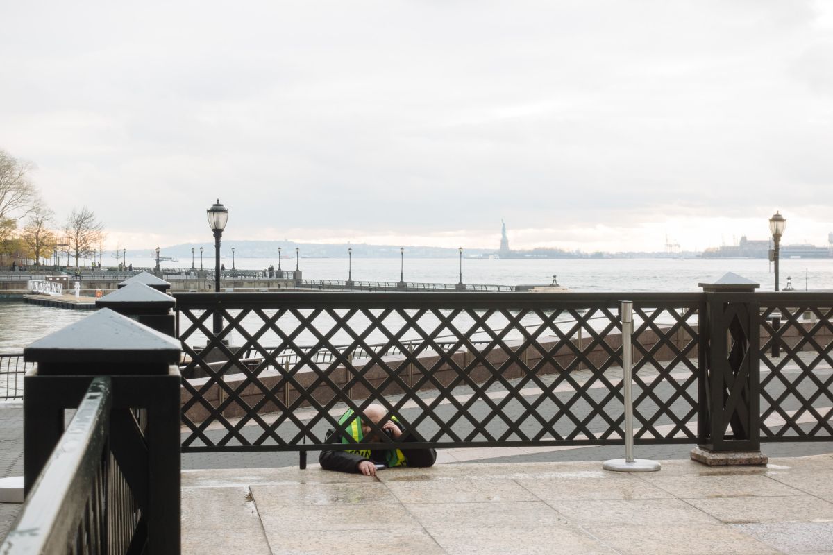 Security guard on a call in the Battery Park Esplenade