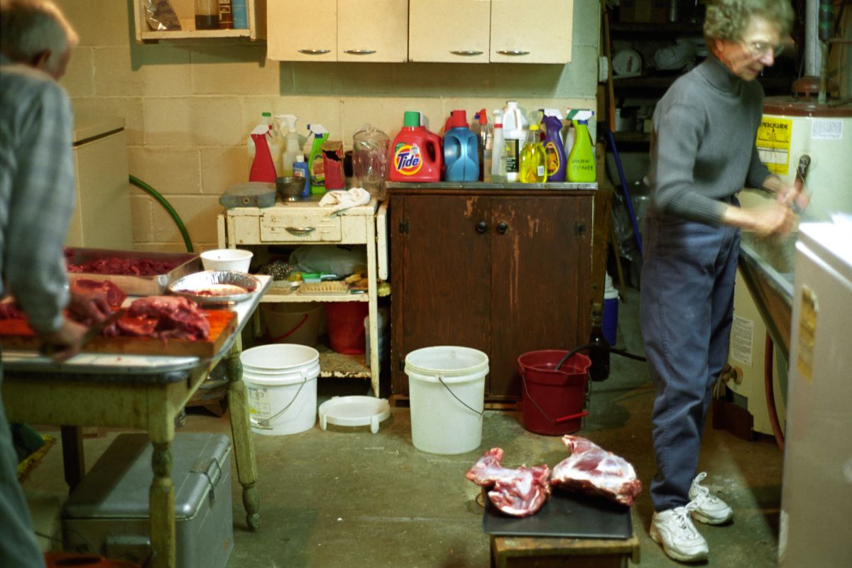 elderly couple carving deer in basement of wexford pittsburgh pennsylvania