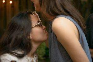 A guest evaluates the pheromone another guest was spritzed with.